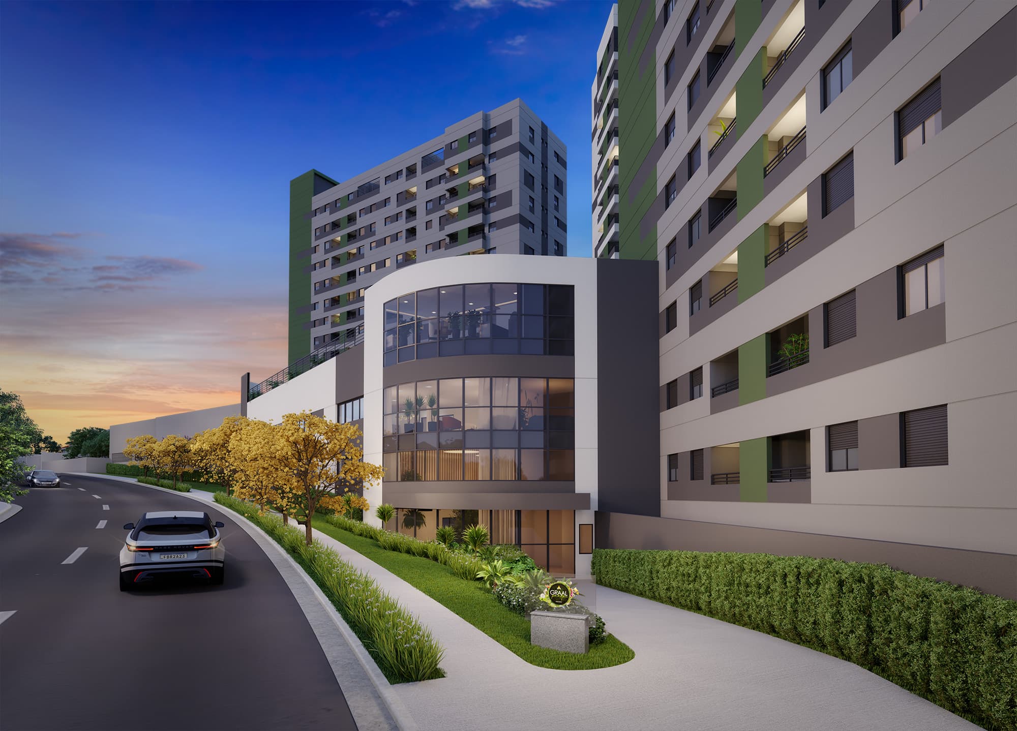 Fachada de edifício com estrutura moderna, vidraças e paisagismo na entrada.